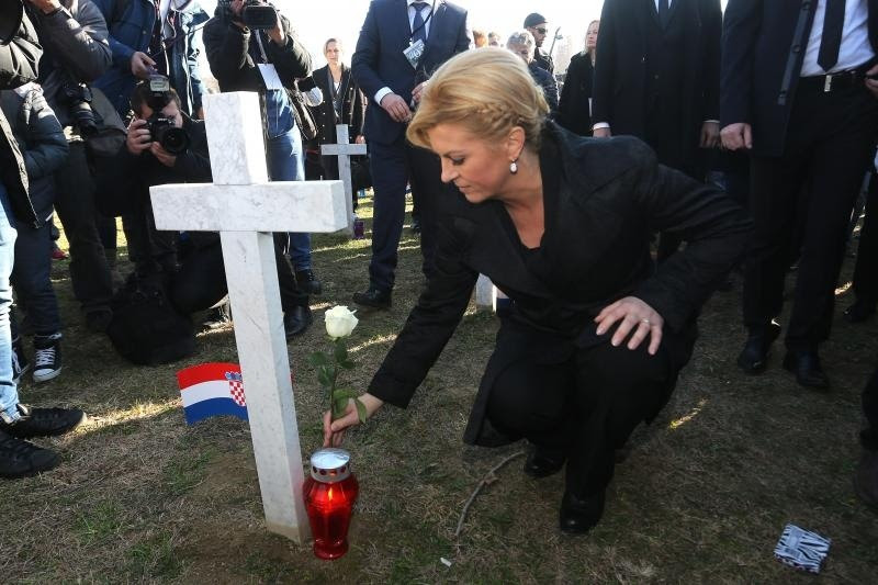 President Kolinda Grabar-Kitarovic lights candles at Vukovar Memorial Cemetery 18 November 2016 Photo: Marko Markonjic/Pixsell