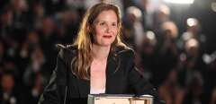 French director Justine Triet poses with the trophy during a photocall after she won the Palme d'Or for the film "Anatomie d'une Chute" (Anatomy of a Fall) during the closing ceremony of the 76th edition of the Cannes Film Festival in Cannes, southern France, on May 27, 2023. (Photo by Patricia DE MELO MOREIRA / AFP)