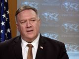 Secretary of State Mike Pompeo speaks during a news conference at the State Department on Wednesday, March 25, 2020, in Washington. Pompeo said Wednesday that the Group of Seven members were all aware of China&#39;s &quot;disinformation campaign&quot; regarding the coronavirus outbreak, as the two countries dispute the origins of the disease. (Andrew Caballero-Reynolds/Pool Photo via AP)