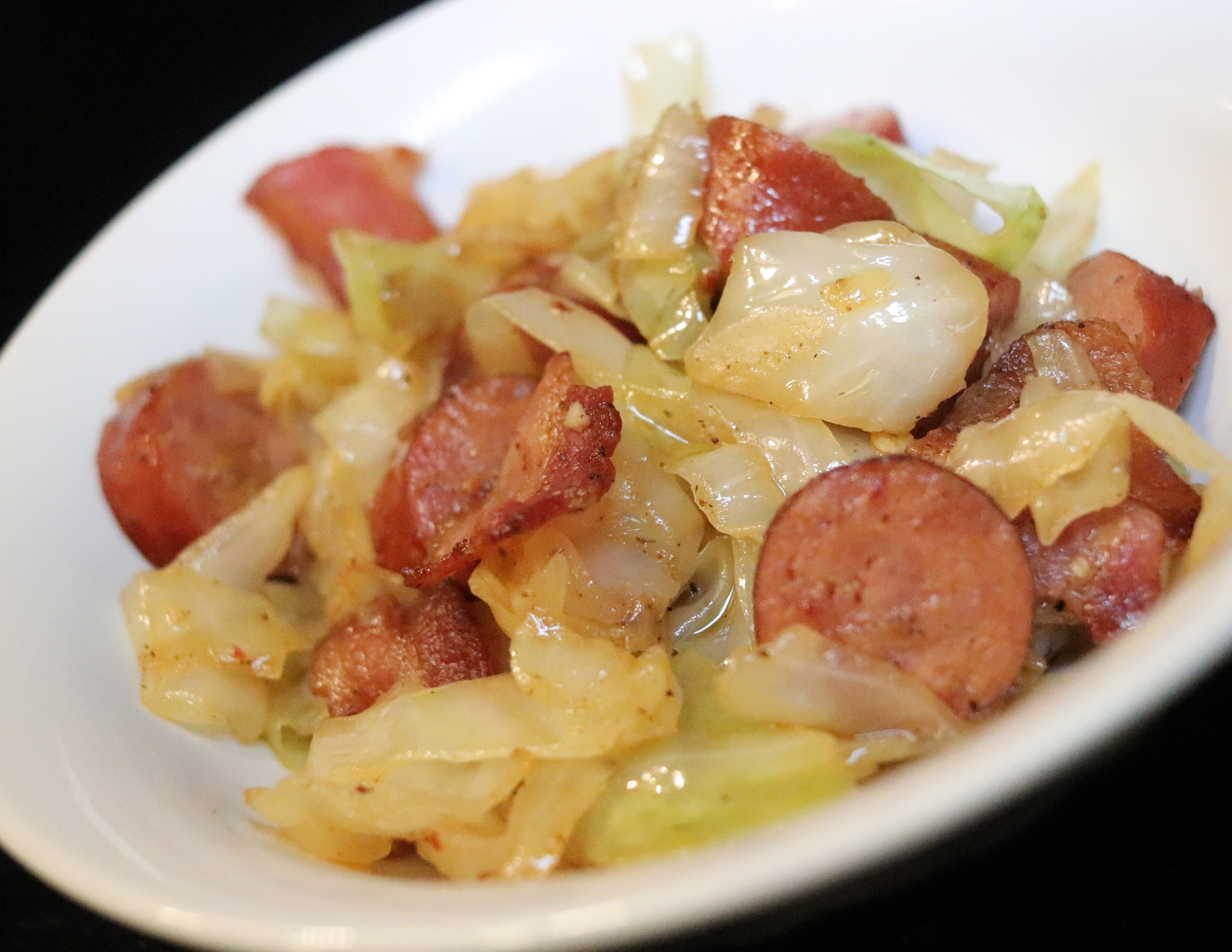 Add sliced kielbasa to the pan and sauté until slightly browned. Keto Fried Cabbage With Sausage And Bacon Tryketowith Me