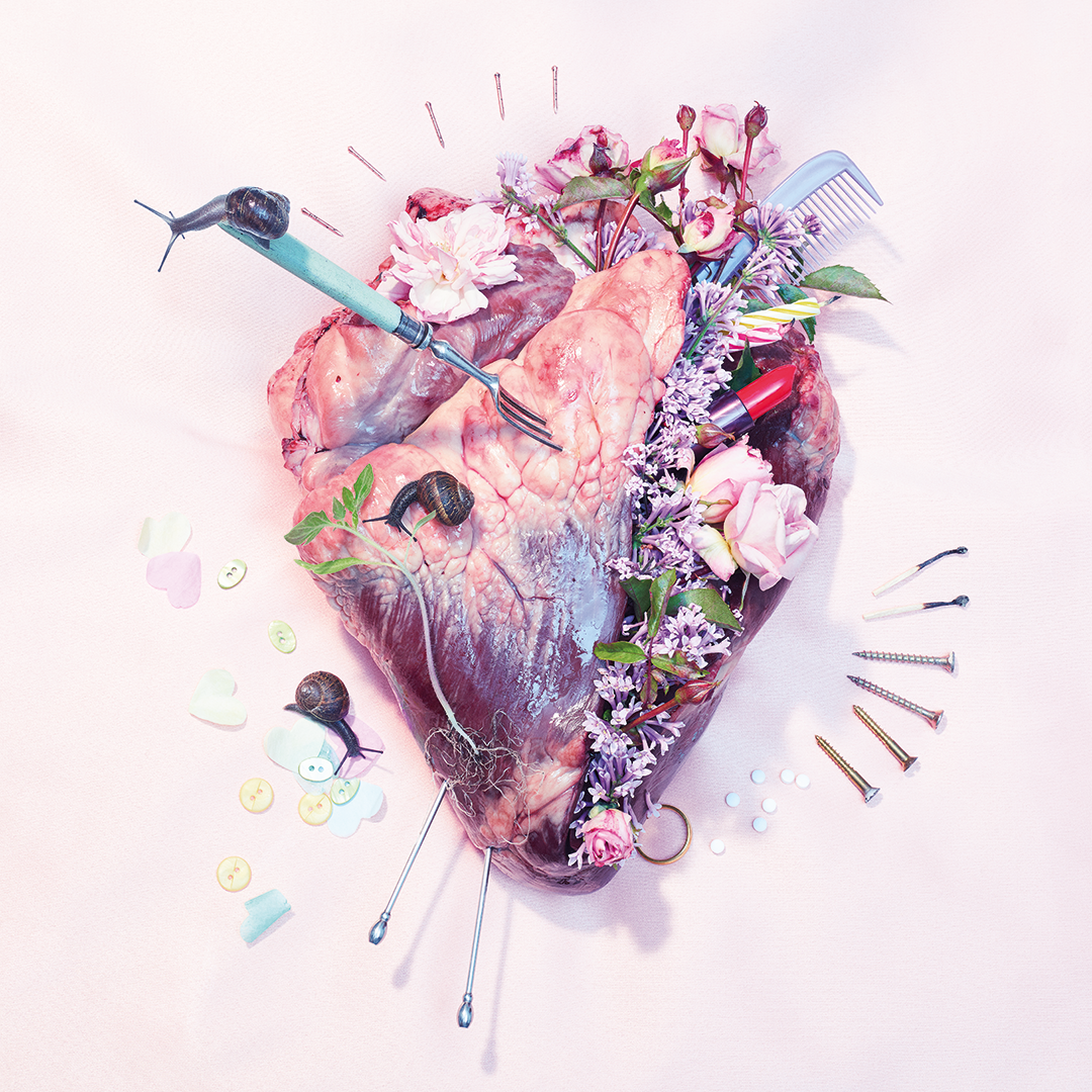 An image of a heart with details added onto it: a fork, snails, lipstick, flowers etc.