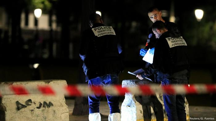 French police stand at the scene of a stabbing attack in Paris (Reuters/G. Fuentes)