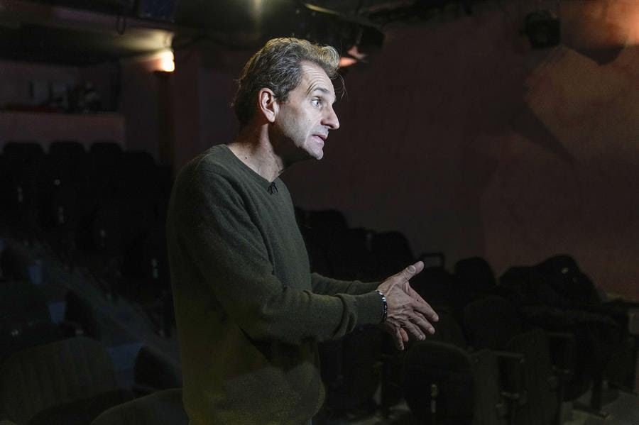 Author and actor Laurent Martinez gestures as he speaks during an interview with The Associated-Press at "Theo Theater" in Paris, Thursday, Oct. 7, 2021.