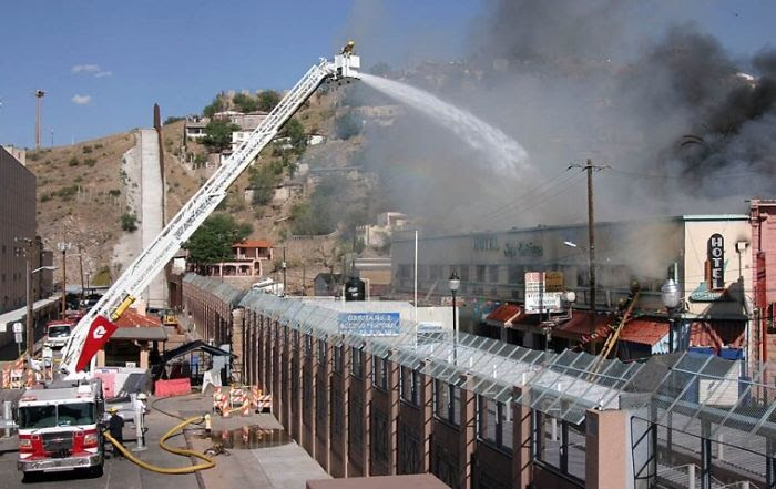 Firefighters In Arizona Putting                                              Out A Mexican Fire