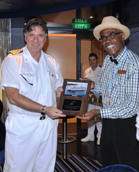 A plaque exchange with the Captain of Carnival Sunshine and Jaques Bajal, Martinique Tourism Authority.