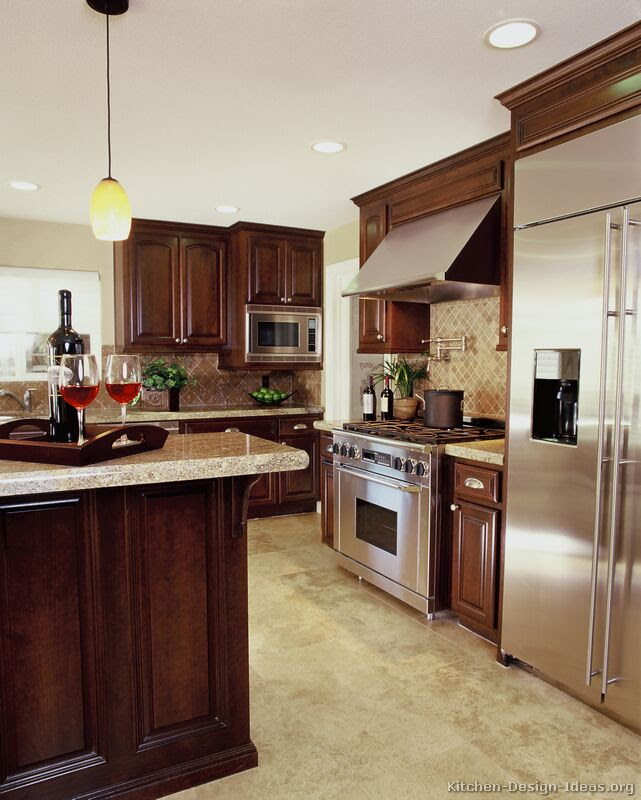 Go with either a lighter or darker stain for hardwood floors, or choose a light colored vinyl, linoleum or tile floor. A Luxury Kitchen With Cherry Cabinets And A Large Island