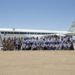 students in front of an aircraft