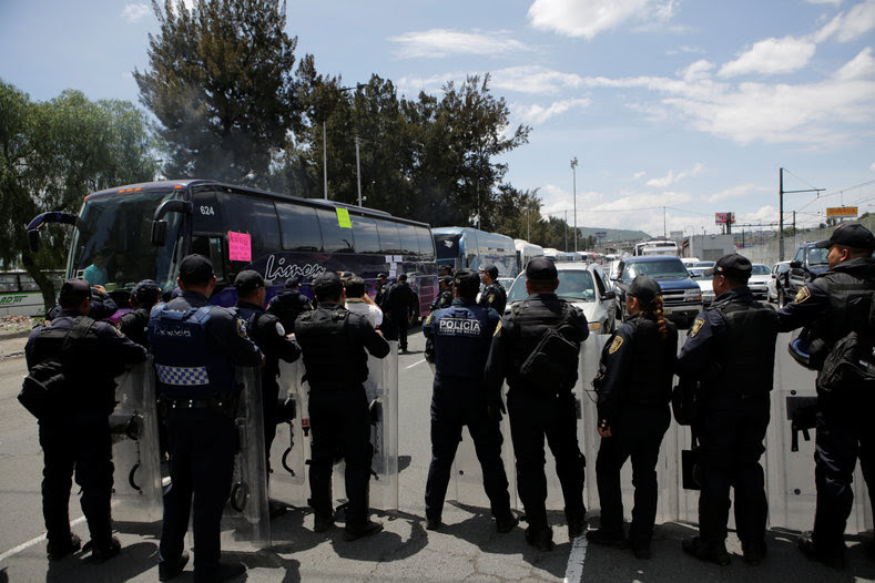 Protesters from the National Coordinator of Education Workers (CNTE) teachers’ union arrive in Mexico City to attend a march against President Enrique Peña Nieto