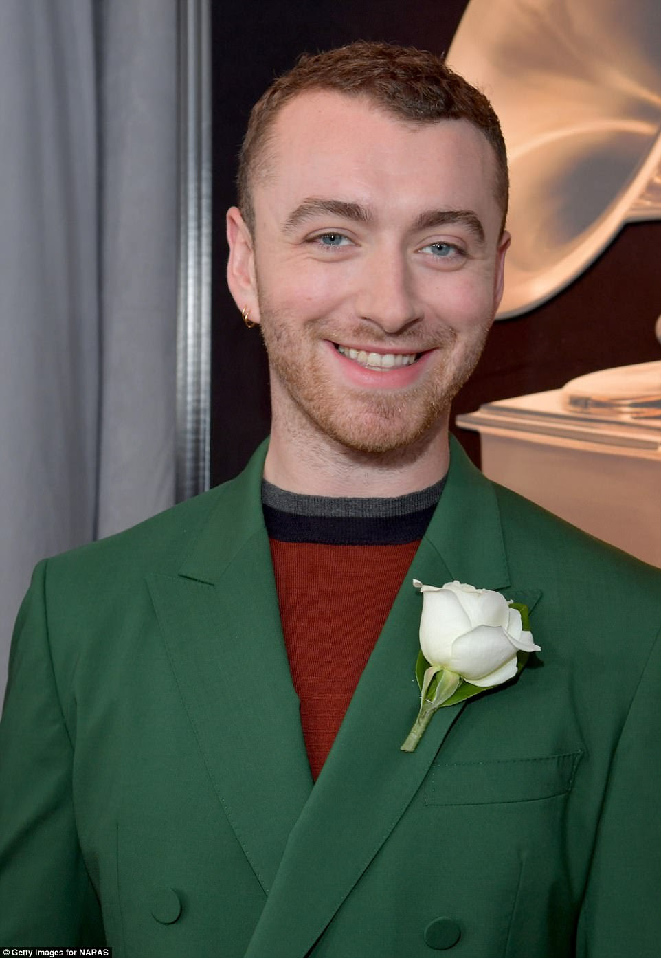 Quirky: Standing out from the crown, the hitmaker, who is in a relationship with 13 Reasons Why star Brandon Flynn, stood out from the crown due to his suit's colour, which he teamed with a brown top underneath