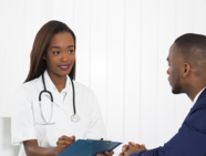 A doctor seeing a patient to discuss his health