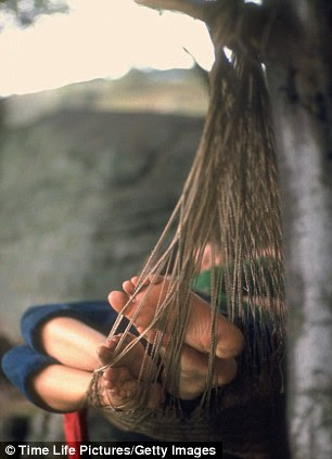 Concert-goers slipping in a hammock