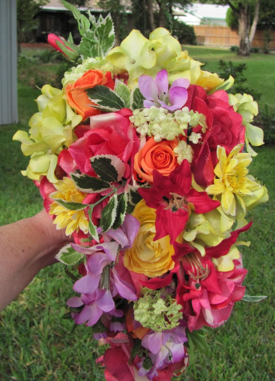 This also sets us apart from many florists, by producing 90% of our foliage requirements. Tropical Bridal Bouquet A Cascading Bridal Bouquet For A Bride Who Loves Bright Wedding Flowers Of Pink Orange Yellow Green And Purple 2507143 Weddbook