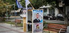 A kiosk of far right party's Spartiates (Spartans) showing a portrait of former ultra-nationalist Golden Dawn party spokesman, Ilias Kasidiaris, who is sentenced to 13-and-a-half years in prison as a member of a criminal organization, stands in a square in southern Greek city of Kalamata on June 25, 2023. (Photo by STRINGER / AFP)