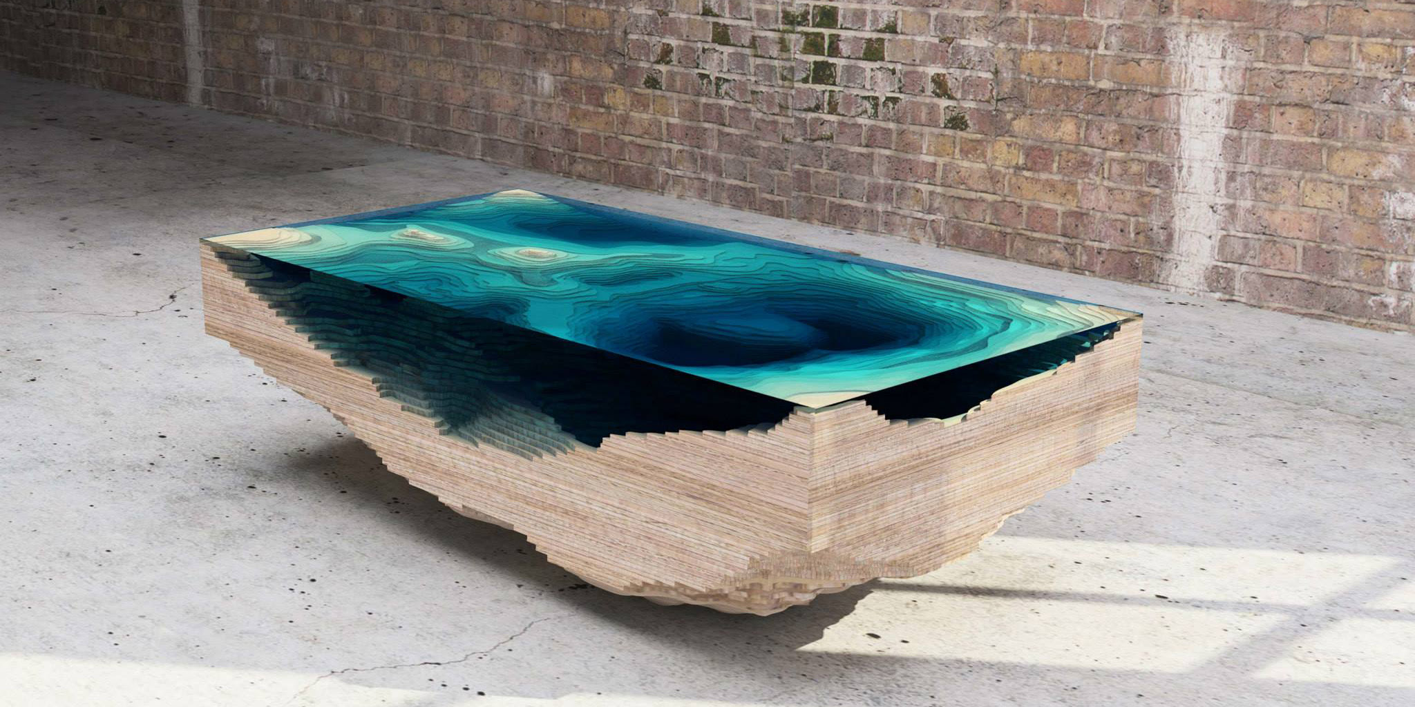 See the detailed photo here. Coffee Table Made Of Layered Glass To Resemble The Depths Of The Ocean Demilked