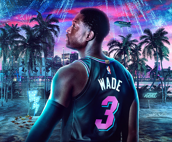 Miami Heat icon Dwyane Wade stands side on in the NBA 2K series, with a sandy beach scene in the background and fireworks lighting up the night sky.