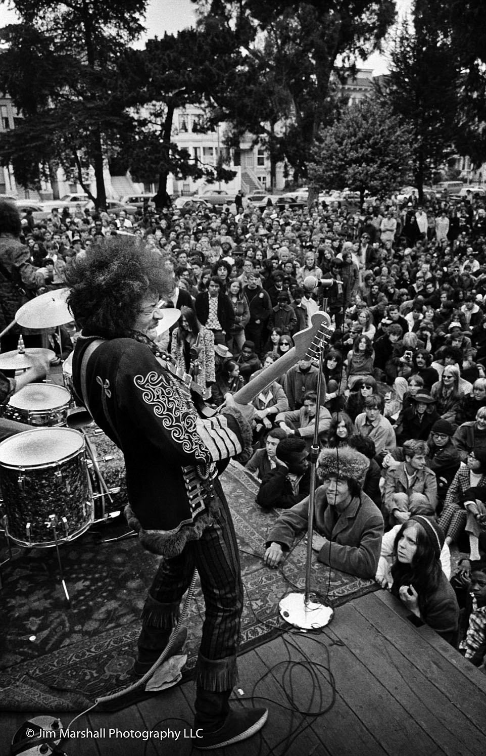 Jimi Hendrix performs at a free concert in the Panhandle park in San Francisco on June 19, 1967, for crowds that had gathered from across the country to share liberal ideas, listen to music, protest the Vietnam War and experiment with drugs. Photographer Jim Marshall would capture another iconic image of Hendrix the same 'Summer of Love' when the musician set his guitar alight during the Monterey Pop Festival