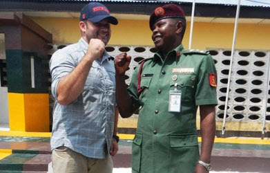 Centers for Disease Control and Prevention (CDC) epidemiologist, Bryan (left), posing next to a member of the Nigerian Army Medical Corps