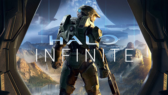 Halo Infinite game art: The Master Chief stands in front of a vast landscape with mountains and fog.