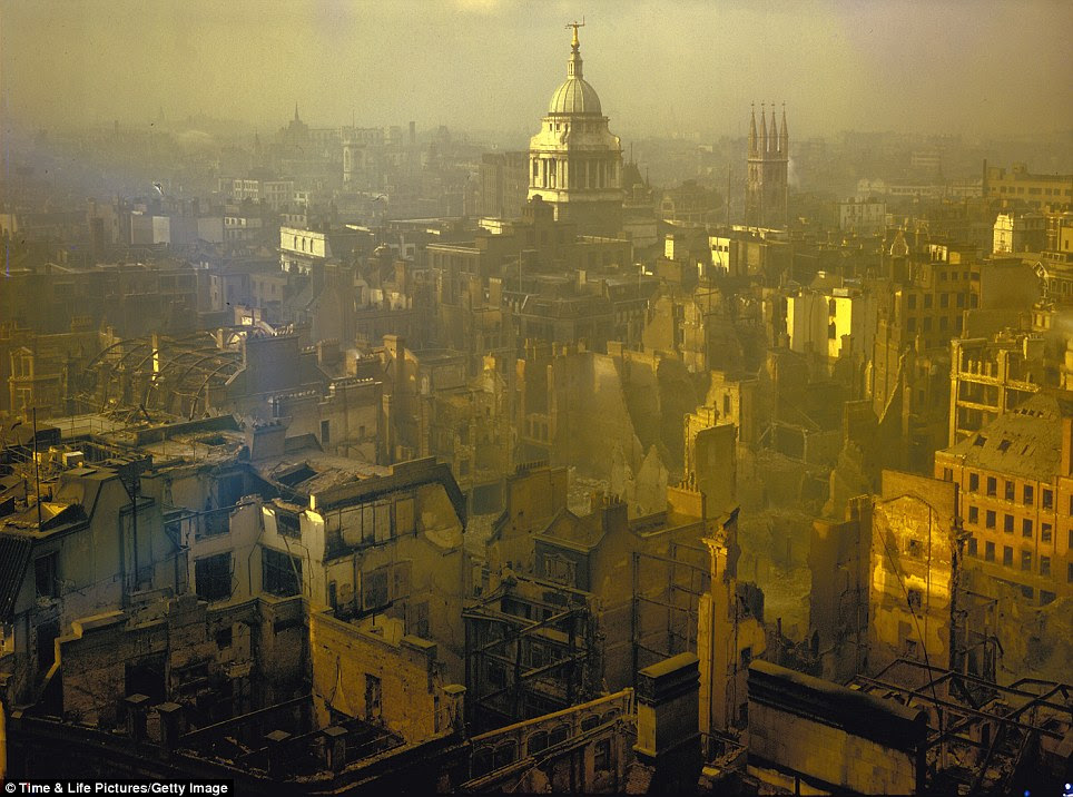 Standing tall: The spire of the Central Criminal Court - better known as the Old Bailey - rises defiantly in a landscape scarred by a heavy German air raid