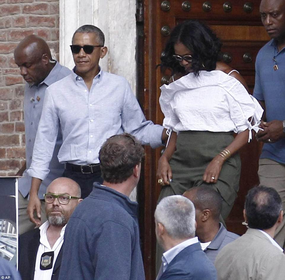 Star treatment: A massive crowd cheered after spotting the couple, with some fans yelling, 'President Obama!'