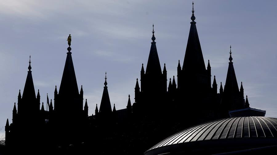 A picture of the Salt Lake Temple of The Church of Jesus Christ of Latter-day Saints roof against a blue sky.