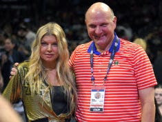 Singer Fergie, left, poses with Los Angeles Clippers owner Steve Ballmer prior to an NBA basketball game against the Los Angeles Lakers, Wednesday, Jan. 7, 2015, in Los Angeles.