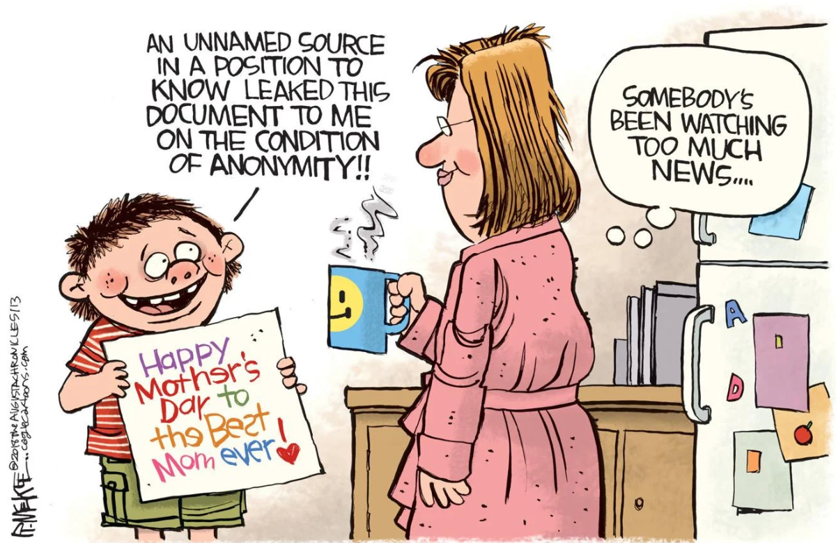 Boy giving card to Mom with disclaimer.