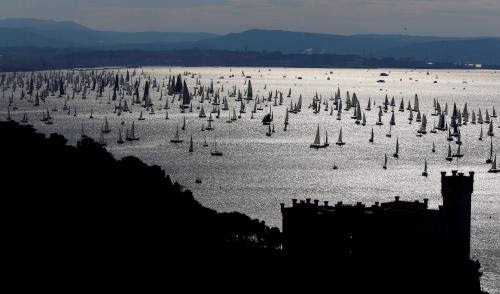 Sailing boats gather at the start of the Barcolana regatta in the Gulf of Trieste 