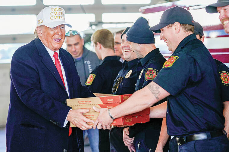 Photo of Trump handing out pizza.