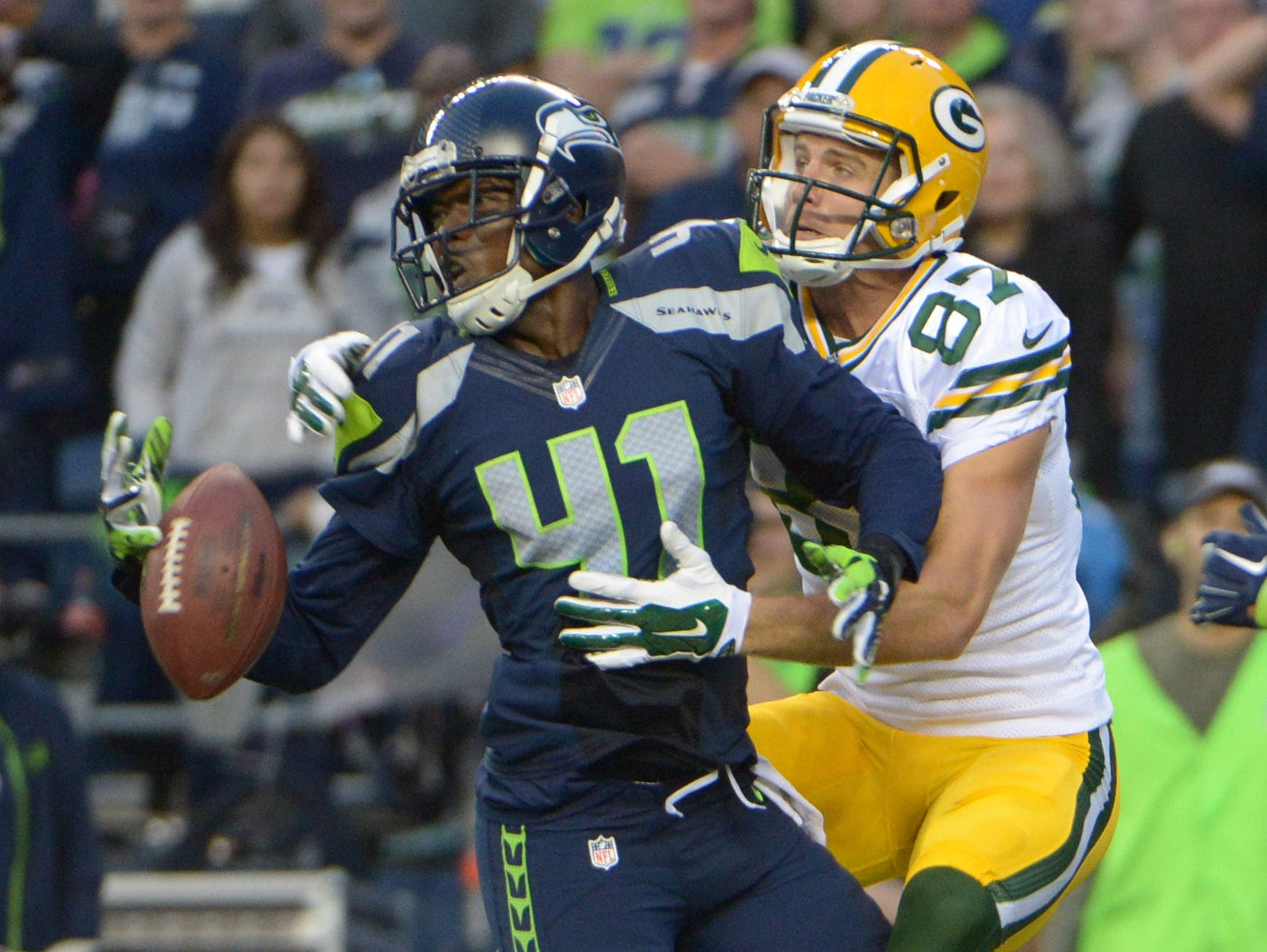 Sep 4, 2014; Seattle, WA, USA; Seattle Seahawks cornerback Byron Maxwell (41) breaks up a pass intended for Green Bay Packers receiver Jordy Nelson (87) at CenturyLink Field. The Seahawks defeated the Packers 36-16. Mandatory Credit: Kirby Lee-USA TO