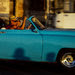 A vintage car cruising down the Malecón, Havana's evocative sea drive, one of its most quintessentially Cuban features.