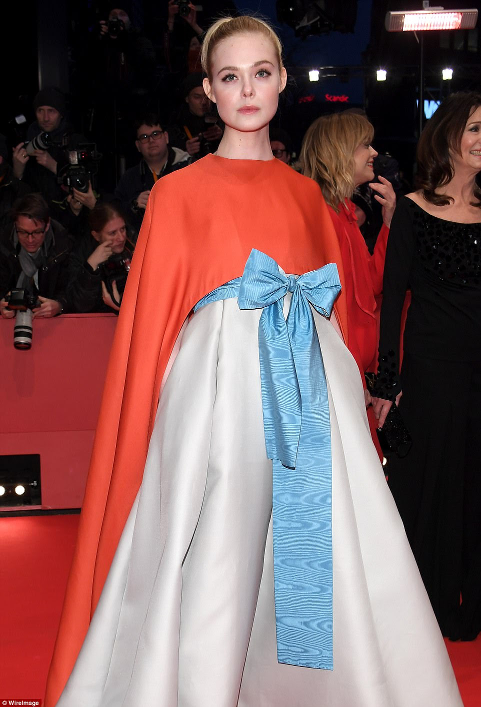 Looking good: American star Elle caught the eye in a sweeping red cape and accompanying silver gown as she made her first appearance at this year’s event 