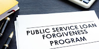 Papers on a desk with the title “Public Service Loan Forgiveness Program.” 
