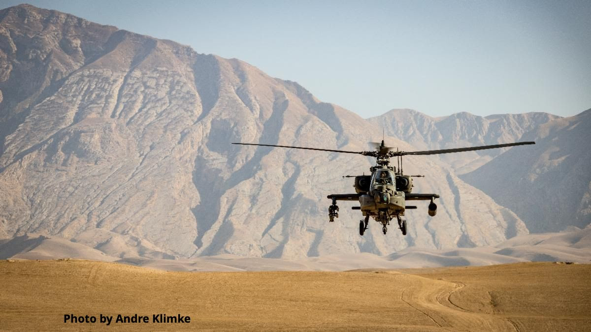 Photo of helicopter flying over Afghanistan Photo by Andre Klimke on Unsplash