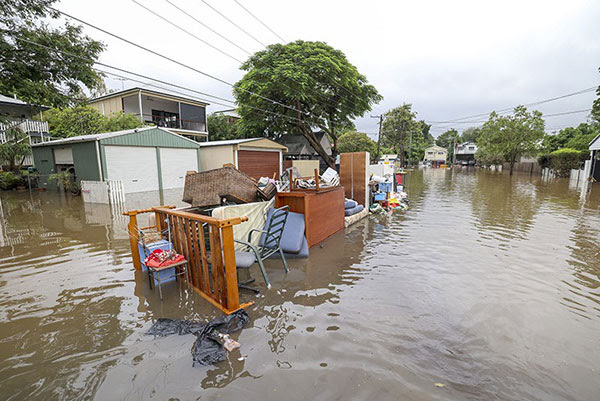 Rubbish and damaged furniture piled up on a flooded road in Brisbane, Australia in March.