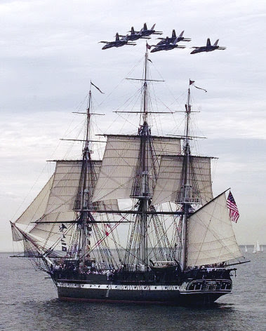 FILE - In this July 21, 1997 file photo, the Blue Angels fly in formation over the USS Constitution as she free sails off the coast of Marblehead, Mass., in celebration of her 200th birthday. The frigate, nicknamed "Old Ironsides," had not sailed on her own for more than 116 years. On Sunday, Aug. 19, 2012, the ship is scheduled to again raise sails on a cruise to mark the day two centuries ago when the Constitution bested the British frigate HMS Guerriere in a fierce battle during War of 1812. (AP Photo/Charles Krupa, File)