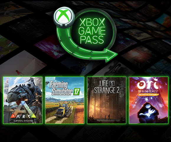 4 video game boxes lined up in a row underneath an Xbox Game Pass sign.