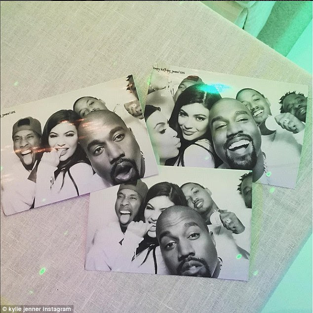 Photobooth fun: Kylie shared this photo as she was was joined by her rapper boyfriend Tyga, sister Kim Kardashian and an unusually cheery Kanye West