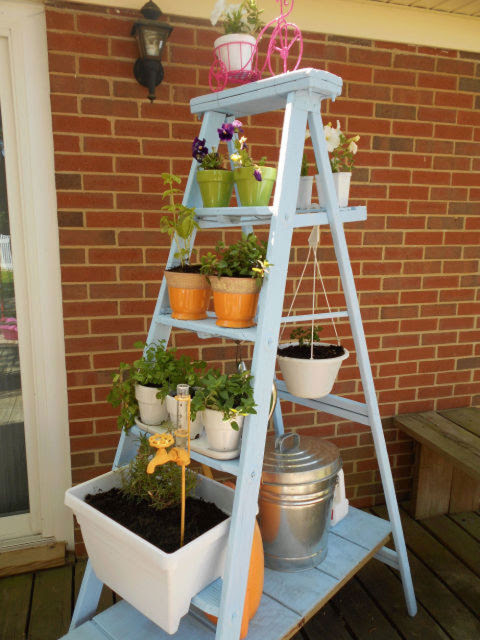 For a decidedly less construction-heavy project, neatly stack pots on the rungs of a ladder. For a bit more flourish, add a hook for a hanging planter.
Get the tutorial at Small Town Rambler.