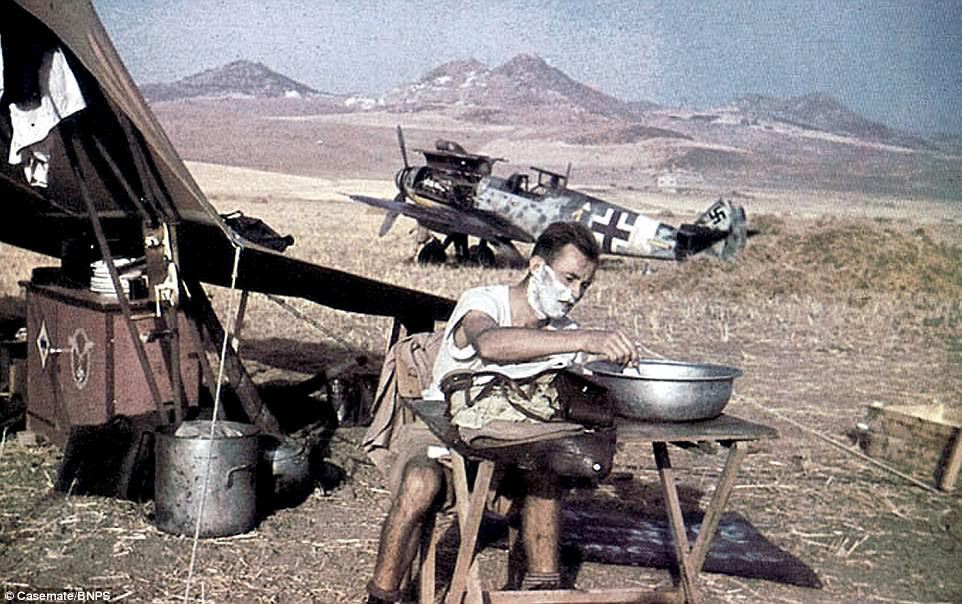 A pilot takes a moment to shave as he camps next to his Messerschmitt Bf 109 fighter plane, somewhere in Italy, in 1943. It was during this year that the Allies launched their Italian Campaign with the invasion of Sicily