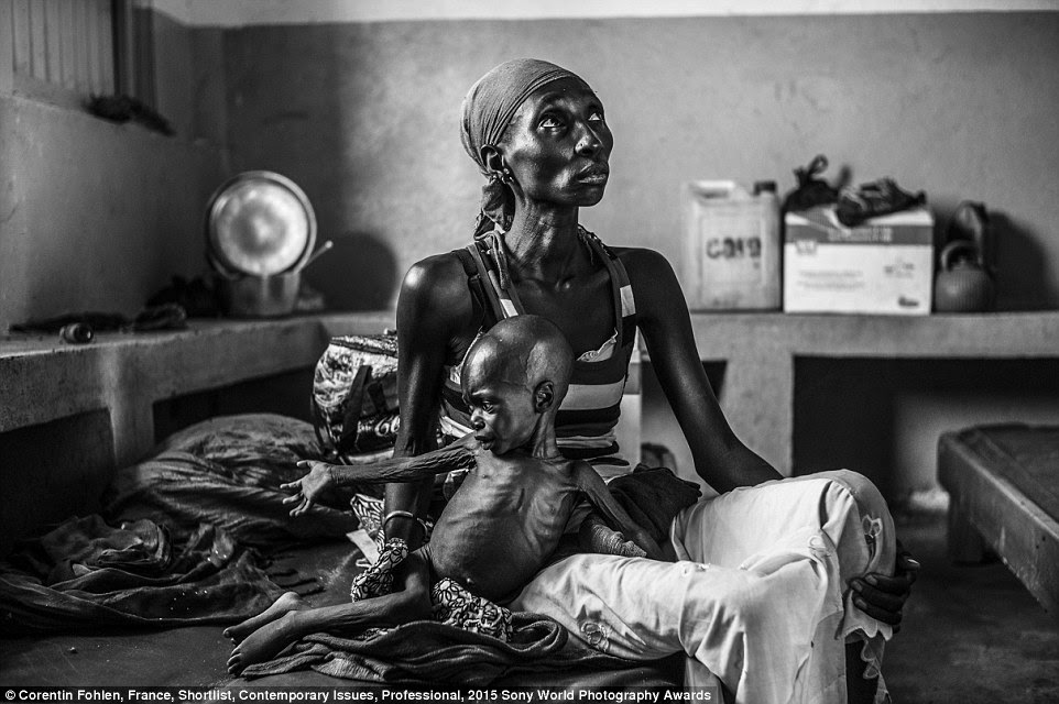 Hunger: Guidi Oumarou, 19, a refugee from Central African Republic, site on a bed at Gore hospital in eastern Chad, where her two-year-old son is being treated for acute malnutrition. Lack of funding has forced the World Food Programme has cut aid to refugees here by 60 per cent