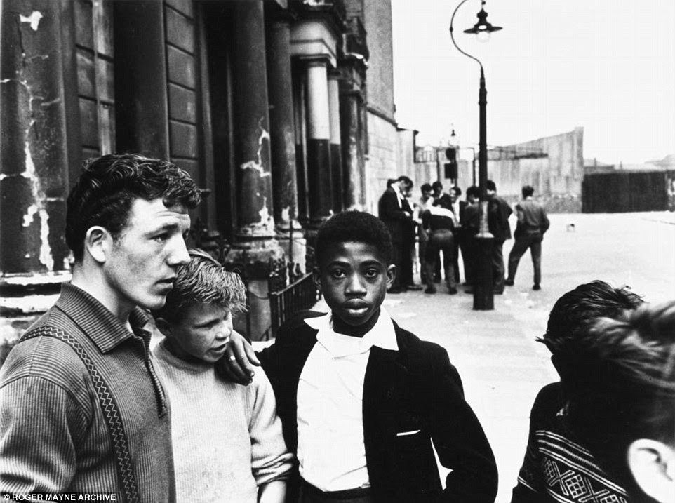 Youngsters huddle in Southam Street in 1959. The decade saw teenagers begin to dictate popular culture