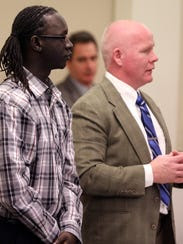 Peterpal Tutlam, left, stands with attorney David Harris,