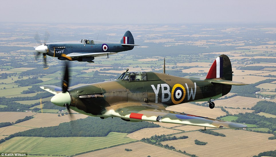 Flying close: A Hurricane and Spitfire take part in a Battle of Britain Memorial Flight. The photos are taken from a book by Keith Wilson, and Haynes Publishing