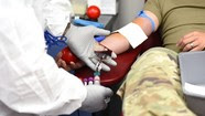 a service member donates blood