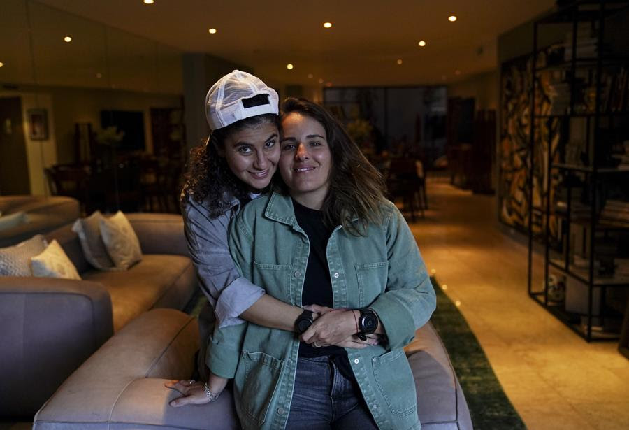 Saskia Niño de Rivera, right, a Mexican civil rights activist, and her girlfriend Mariel Duayhe, a sports agent for Mexican soccer players, pose for a photo at their apartment.