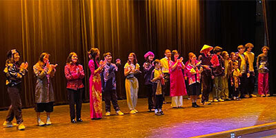 Students onstage for curtain call