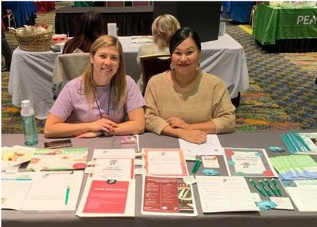 NACC dietitian Jessica Thurin (left) and community health educator Chenoa Stout (Spirit Lake Nation) staff a table at a community event.