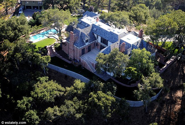 All yours: This five-bedroom home complete with a gym, wine cellar, swimming pool, sauna and spa also has a gated private driveway while listed for $7,000,000 in Los Altos Hills, California