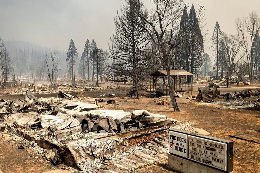 A church marquee stands among buildings destroyed by the Dixie Fire in Greenville.